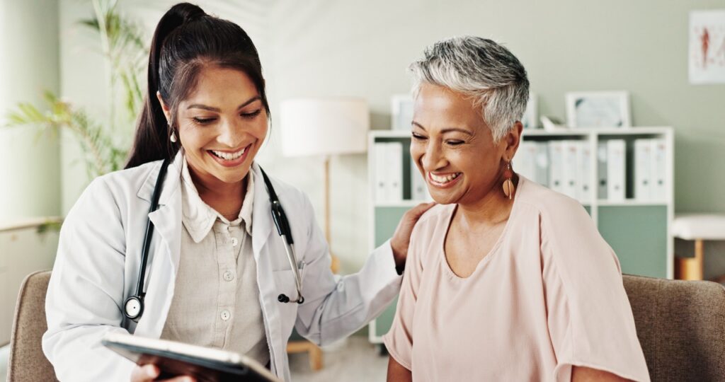physician speaking to patient in office